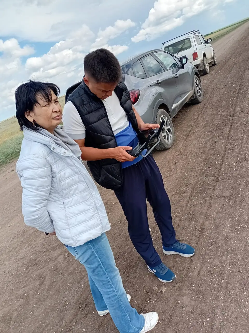 Rodina working trip field inspection with drone equipment