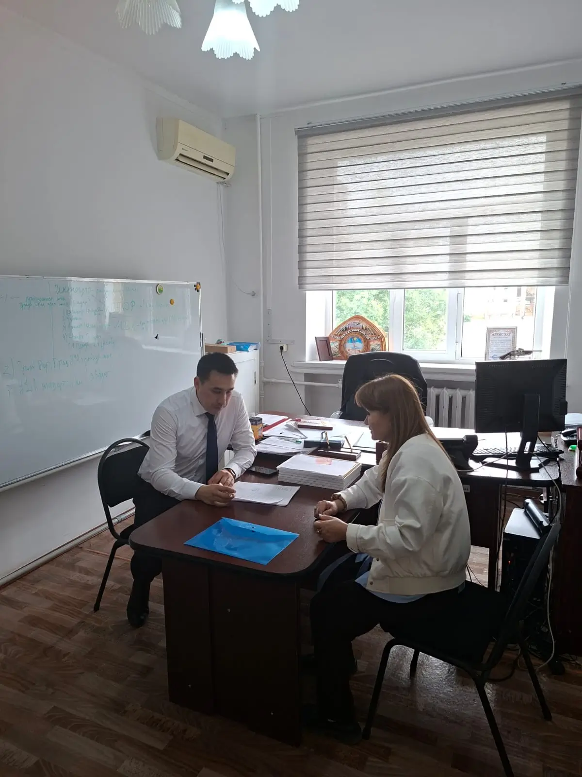 Survey work with local residents in Zhanibek district