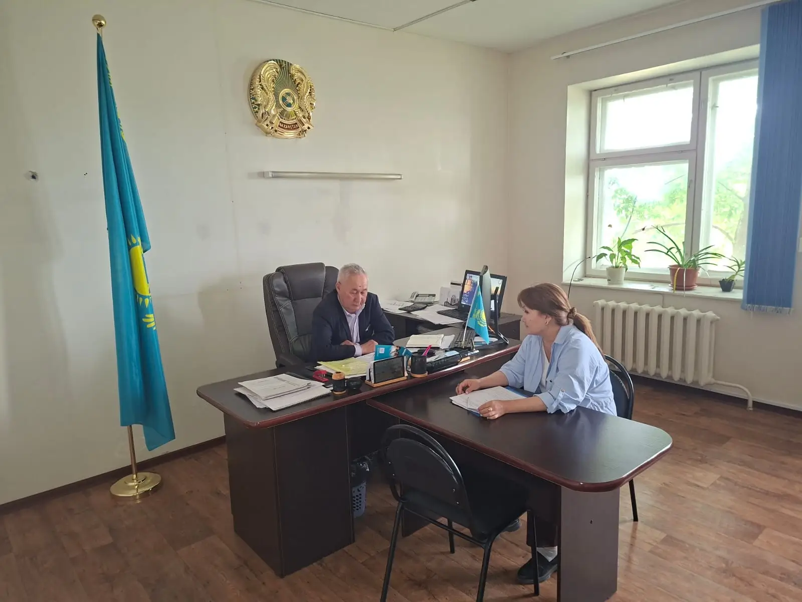 Discussion with farm representatives in Zhanibek district